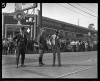 Officer W. O. Mellon with Hayward Thompson during one of his stunts, Los Angeles, 1927