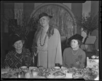 Three members of the Hollywood Opera Reading Club pose at a table, 1936