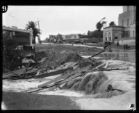 Rainstorm flooding on Wilshire Blvd. in front of the Wilshire Christian Church, Los Angeles, 1927