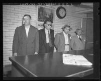 Jimmy Rist, Sol Davis, Mickey Cohen and Mike Howard being booked on suspicion of murder in Los Angeles, Calif., 1948