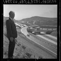 Bill Lloyd looking over Long Beach and San Bernardino Freeways interchange on opening day, 1965