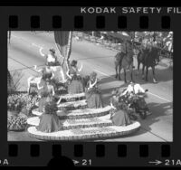 Rose Queen Kristina Kaye Smith and her court on Rose Parade float in Pasadena, Calif., 1984