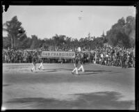 Four men carrying "San Francisco" banner at the Tournament of Roses Parade, Pasadena, 1929