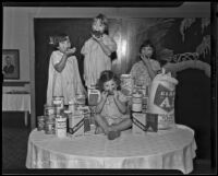 Little girls with donated goods at the Los Angeles Orphans' Home Society, Los Angeles, 1935