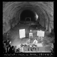 Tom Bradley and Baxter Ward holding press conference in old Pacific Electric Tunnel to propose rail system plan in Los Angeles, Calif., 1975