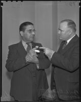 Judge William R. McKay and Bailiff Paul L. Brunette with his injured finger, Los Angeles, 1935