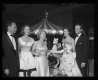 Santa Anita Derby Ball attendees, from left, Mr. and Mrs. Charles Shoemaker, Mrs. Spencer Tracy, and Mr. and Mrs. Lawrence Bird, 1956