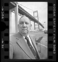 California Assemblyman Vincent Thomas standing under Vincent Thomas Bridge, Calif., 1978