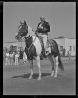 Governor Frank Merriam on horseback at the Pioneer Days parade, Santa Monica, 1935