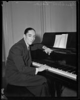 Agustín Lara, Mexican lyricist, singer and actor, seated at a piano, 1930-1939