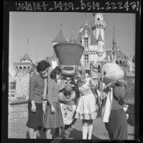 Korean student, Jong Sook Kim, visiting the Mad Hatter and Alice at Disneyland, Anaheim, 1964