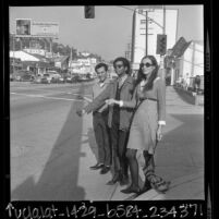 Three youths hitchhiking on the Sunset Strip, Los Angeles, Calif., 1966