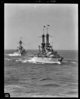 Navy's USS Mississippi battleship streams through the water with a second battleship behind it, Southern California