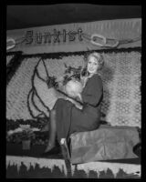 Ramona Franz holds a record size grapefruit at the National Orange Show, San Bernarndino, 1934