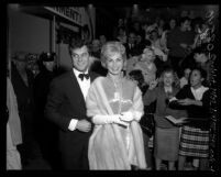 Actors Tony Curtis and Janet Leigh with fans at film premiere of "Pepe" in Los Angeles, Calif., 1960