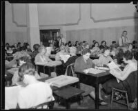 Women at desks with papers, [Los Angeles?], [1930-1938?]
