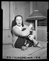 Actress Rita Johnson during interview after release from hospital, Balboa Bay, Calif., 1948