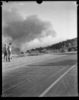 Men observe smoke from the National Forest Inn fire, California, 1932