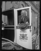 John Cavanagh arrives at the Biltmore Hotel by a horse drawn coach, Los Angeles, 1935