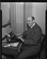 Dr. Morris Fishbein typewriting an article, likely at the Biltmore, Los Angeles, 1935