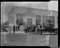 First National Bank, exterior, following robbery, with people gathered, Arcadia, 1922