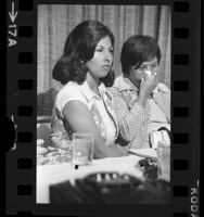 Gloria Molina and Dolores Madrigal holding news conference announcing class action suit against hospital in Los Angeles, Calif., 1975