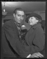 Actress and writer Mae Busch and fiance Thomas C. Tate place a date for their wedding, Los Angeles, 1936