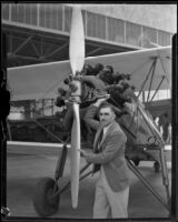 Aviator Paul Mantz poses next to plane, Los Angeles, ca. 1935