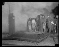 Firemen at the burning Hope Development School for mentally disabled girls in Playa del Rey, Los Angeles, 1924