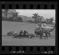 Presidential motorcade begins to assemble near Century Plaza as Lyndon and Lynda Bird Johnson have arrived by helicopter, 1967