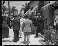 Will Rogers, assisting with arrangements after the death of Florenz Ziegfeld, leaving the Pierce Brothers Mortuary, Los Angeles, 1932