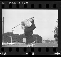 Golfer Laura Baugh, mid-swing in Long Beach, Calif., 1972