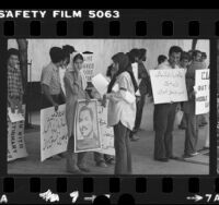 Iranian students with placards in Arabic and English demonstrating in Los Angeles, Calif. against American support of Iraq, 1980