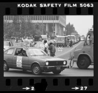 Los Angeles Department of Water and Power workers driving DWP rigs around City Hall in support of strikers in Los Angeles, Calif., 1980