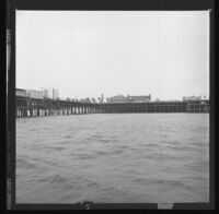 Santa Monica Pier as seen from the ocean. B. 1973