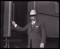 Former district attorney Asa Keyes at train station upon arrival back home from prison, Glendale, 1931