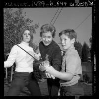 U.S. fencing champion Janice Lee Romary practicing with her children in Los Angeles, Calif., 1968