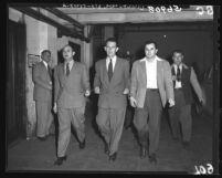 Ben Dobbs, Henry Steinberg and Samuel H. Kashinowitz after being sentenced in Communism investigation, Calif., 1949
