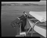 Captain Edward Hyde and Ray Ellis help stop poachers, Newport Beach, 1935