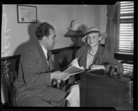 Ann Harding with lawyer Roland Rich Woolley at a deposition, Los Angeles, 1935