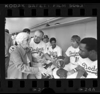 Lillian Carter, escorted by Tom Lasorda meeting players in Dodgers dugout, 1977