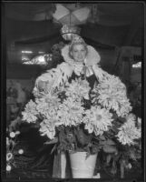 Ethel Ziegler posing with flowers at the Los Angeles County Fair, Pomona, 1935