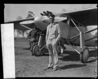 William Hawley Bowlus standing next to an Ryan single engine monoplane, 1920 -1939