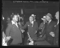 Congressman and labor union leaders in heated argument during Congressional committee inquiry into film strikes, Los Angeles, Calif., 1947