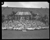 Children surround May Day Queen Allison Saunders and her maid of honor Billie Gygerson, Los Angeles, 1926