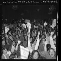 Crowd waving Israeli flags during rally at the Hollywood Palladium in Los Angeles, Calif., 1973