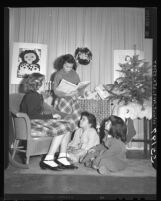 Barbara Dalo reading the Christmas story in combined Christmas and Chanukah program at Evergreen Avenue School in Los Angeles, Calif., 1948