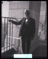 Pioneer Charles J. Prudhomme points towards the view from the City Hall tower, Los Angeles, 1929