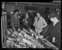 Dolores Beckett, Margery Teague and Jane Woodin at a rummage sale for Children's Hospital, Los Angeles, 1936