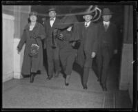 Accused killer Louise Peete is escorted to court to be arraigned for the murder of Jacob Denton, Los Angeles, 1920